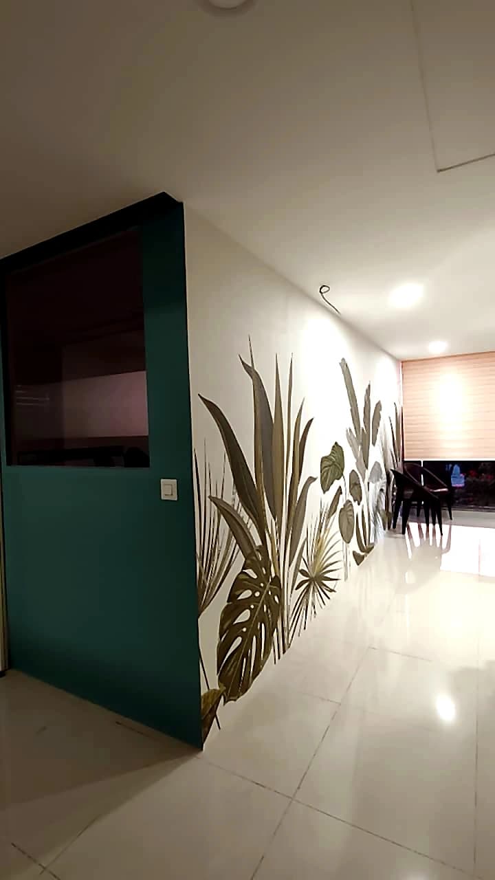 CO-WORK @ Level 3 — the corridor at dusk, past a teal-panelled cabin and along the painted mural