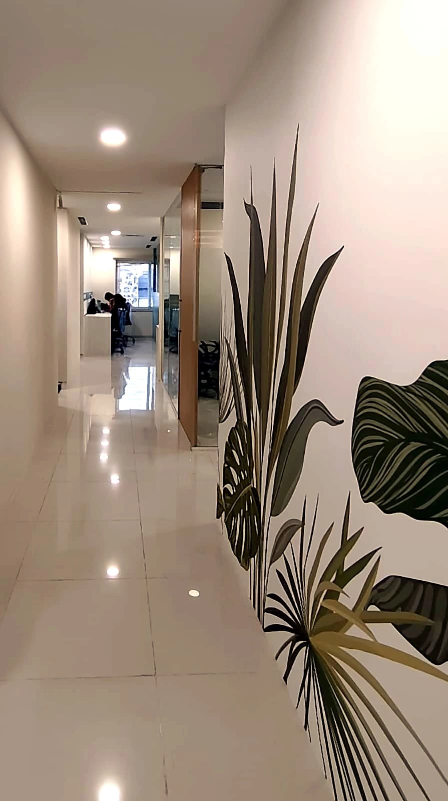 CO-WORK @ Level 3 — the corridor running the length of the floor, mural on one side and glazed cabins on the other