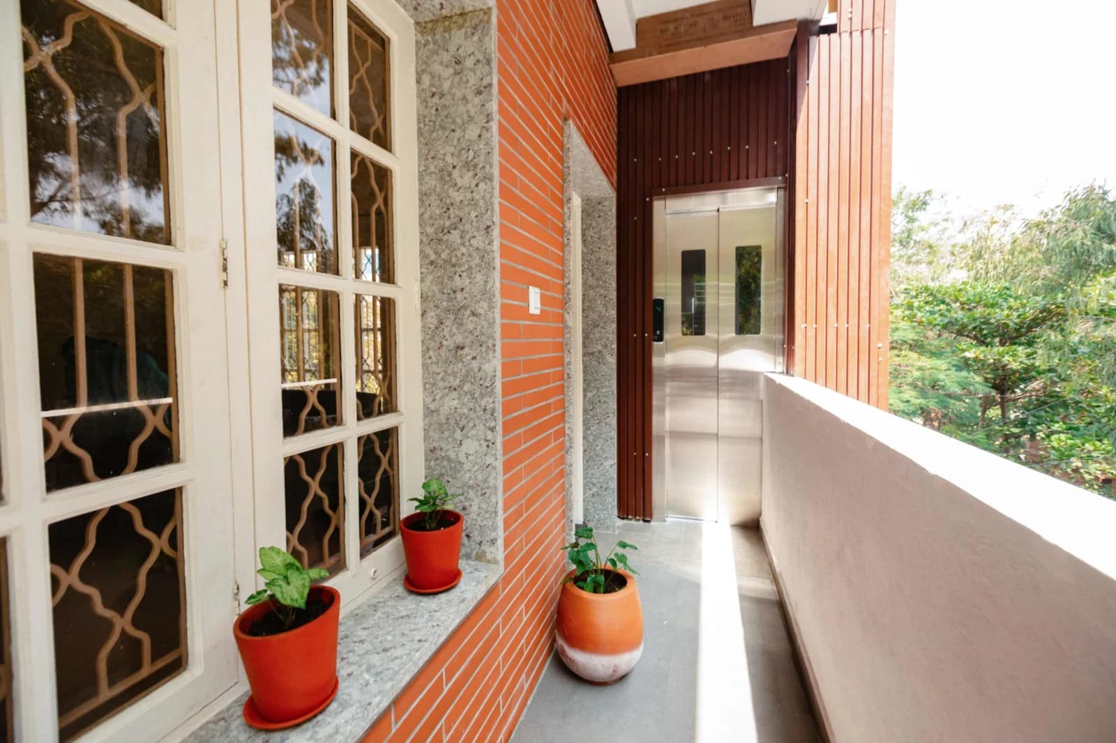 PRAAD Suites — the gallery running back to the lift lobby