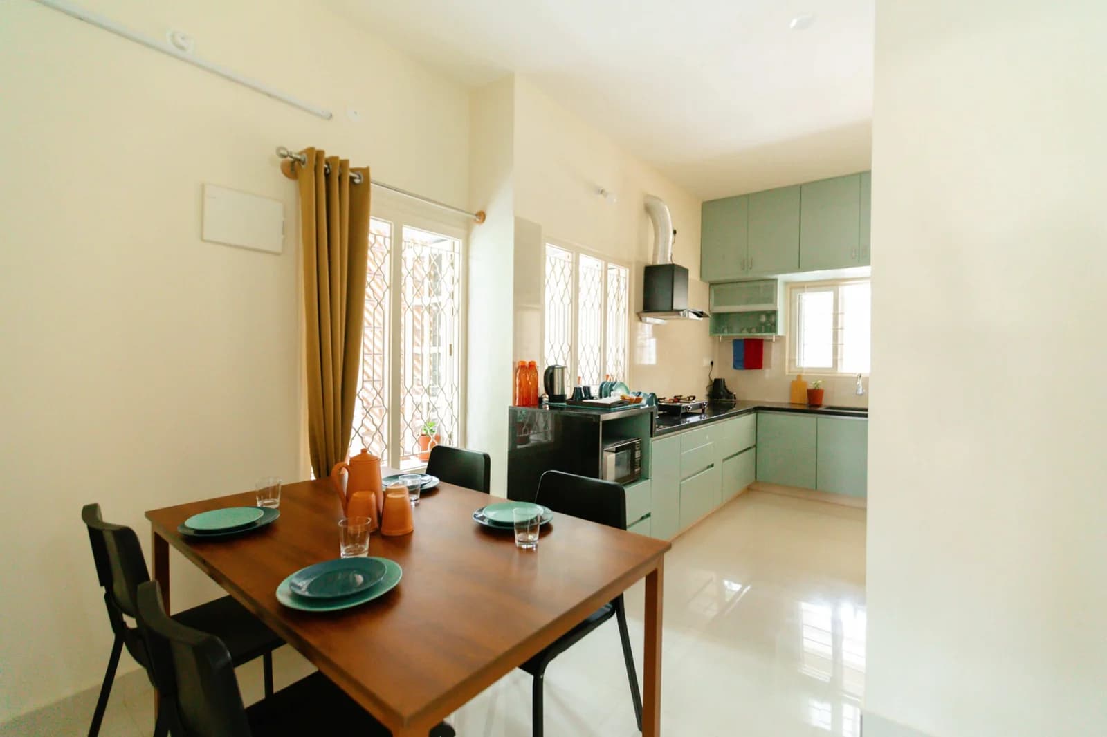 PRAAD Suites — the fitted kitchen and dining corner of a suite