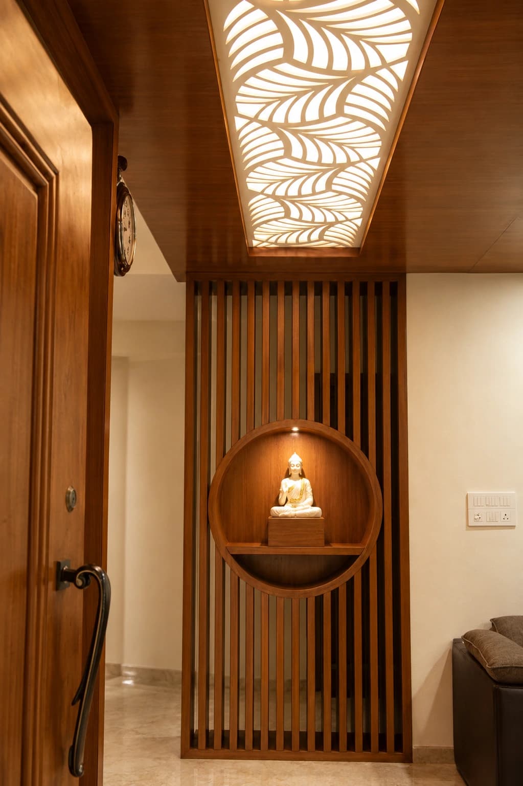 The House of Motifs — entrance foyer with the lit niche and backlit ceiling panel
